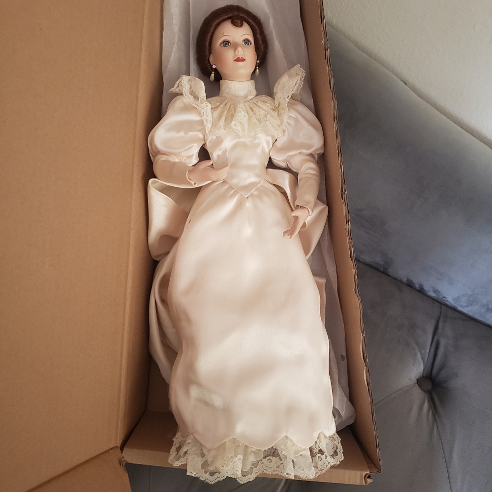 Elegant Cream Doll with Lace Details